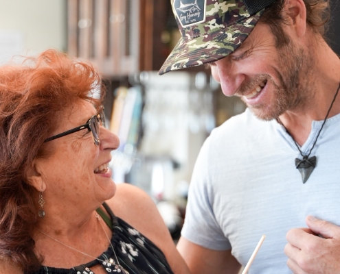 woman and young man laughing and smiling