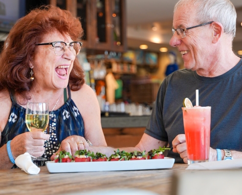 couple laughing and enjoyinga meal